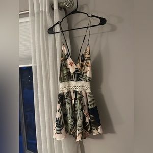 New floral romper! Adjustable tie in the back so you can make it any arm length!